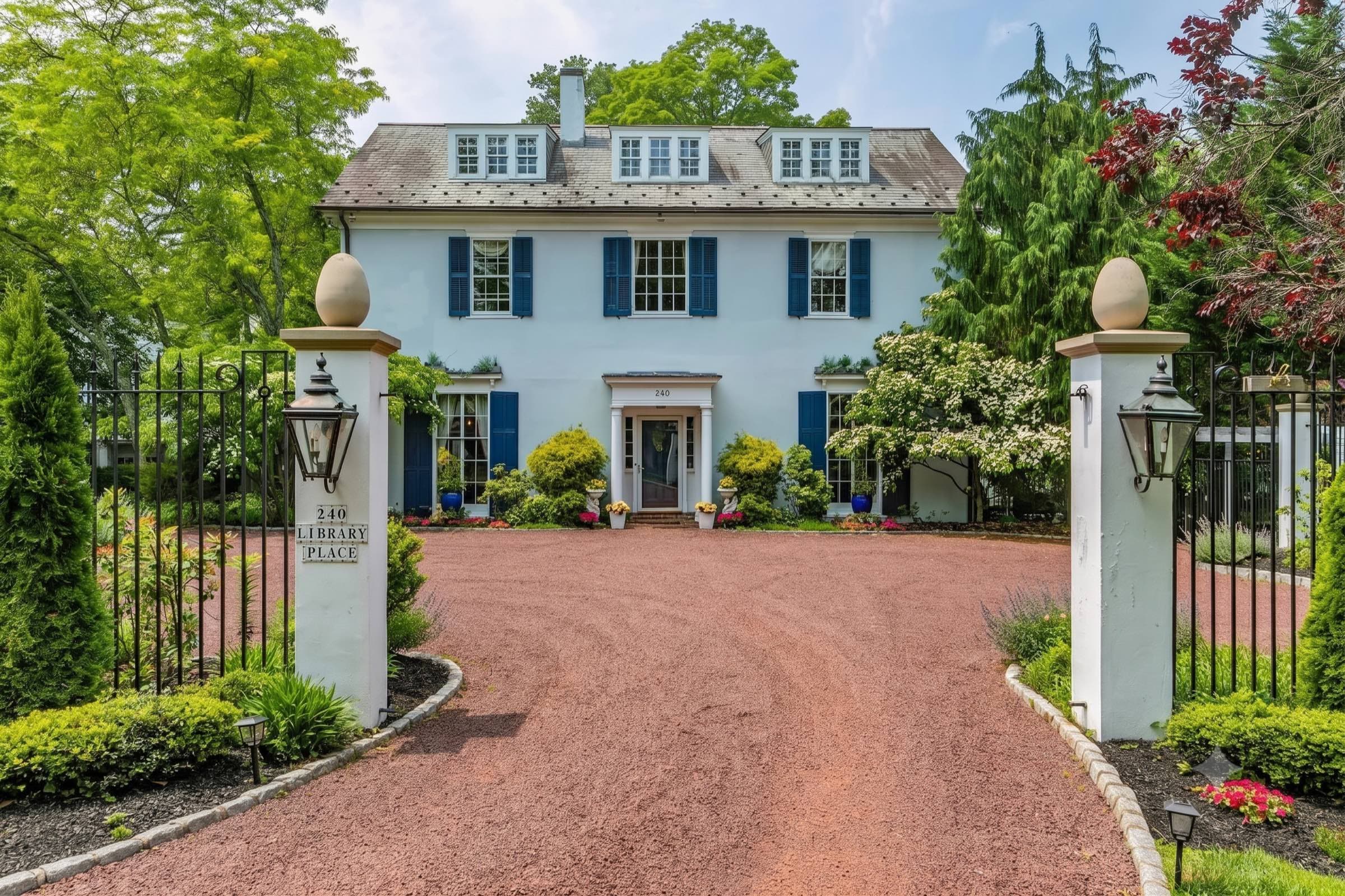 A historic New Jersey colonial home behind a gated drive